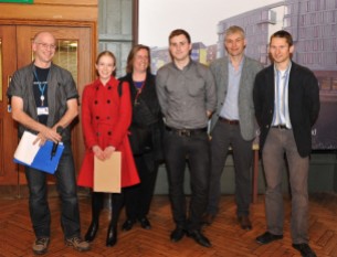 Nicky Willis (centre) wins best talk at the annual postgraduate research symposium